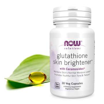 Bottle of NOW Solutions Glutathione Skin Brightener with a green leaf with a gel cap sitting on top