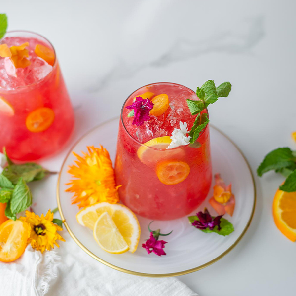 top view of a glass of a hibiscus tropical fruit punch drink