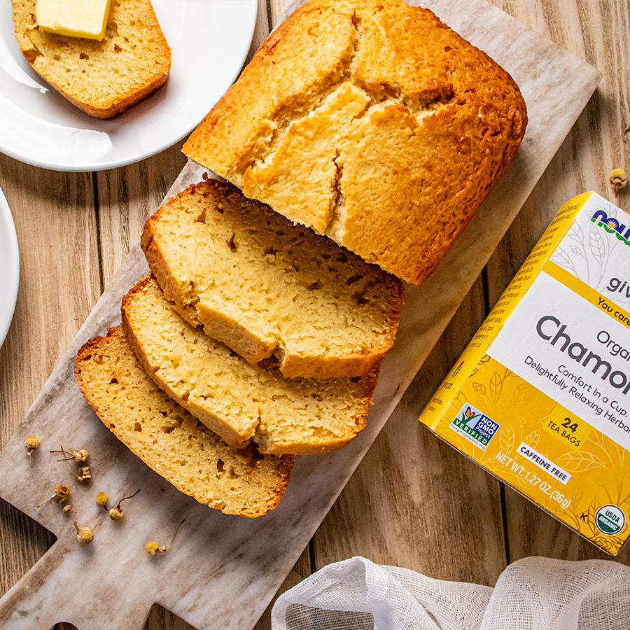 top view of Chamomile Vanilla Quick Bread next to a box of NOW Chamomile tea