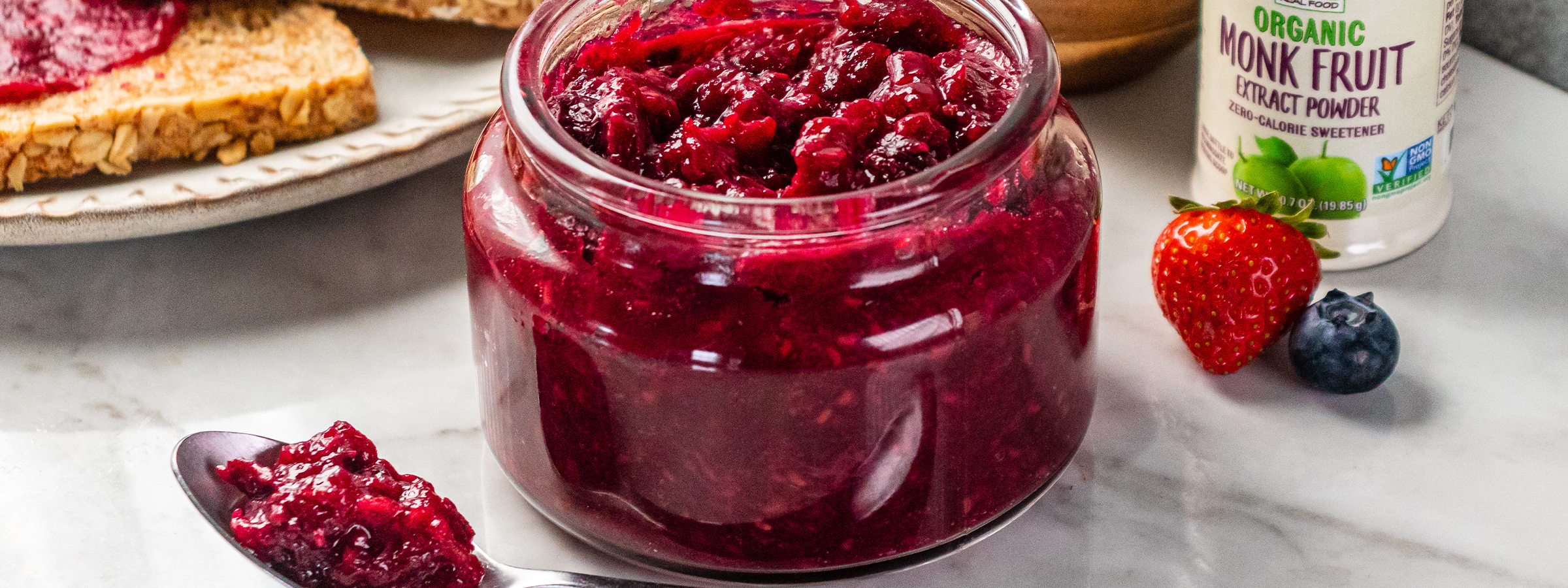 jar of Triple Berry Jam with jar of NOW Monk Fruit in the background