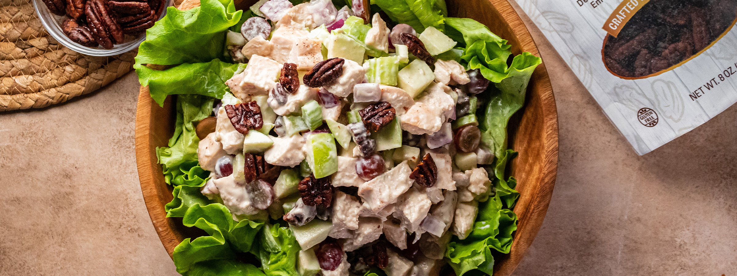 top view of Waldor Chicken Salad in a wooden bowl