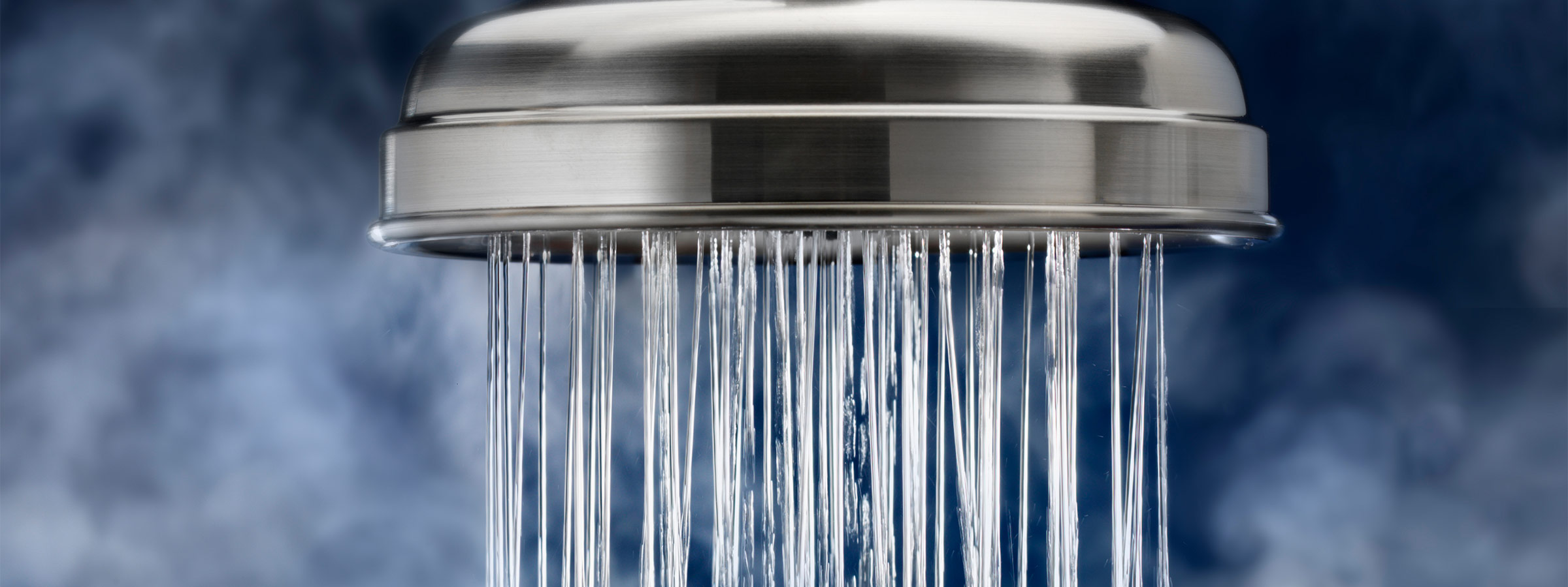 A closeup of water coming out of a shower head
