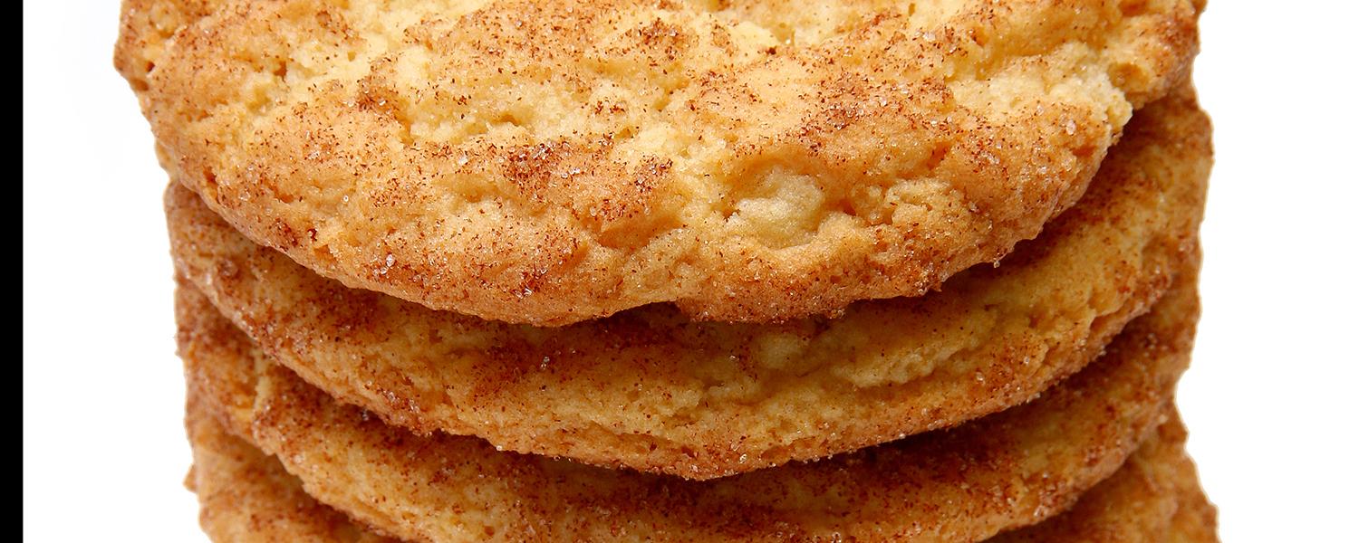 A closeup of a stack of Gluten Free Snickerdoodle Cookies. The salt and cinnamon is visible on the surface of each cookie.