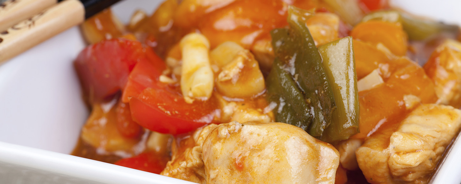 A closeup of a dish of Healthy Sweet-and-Sour Chicken with Organic Quinoa. 