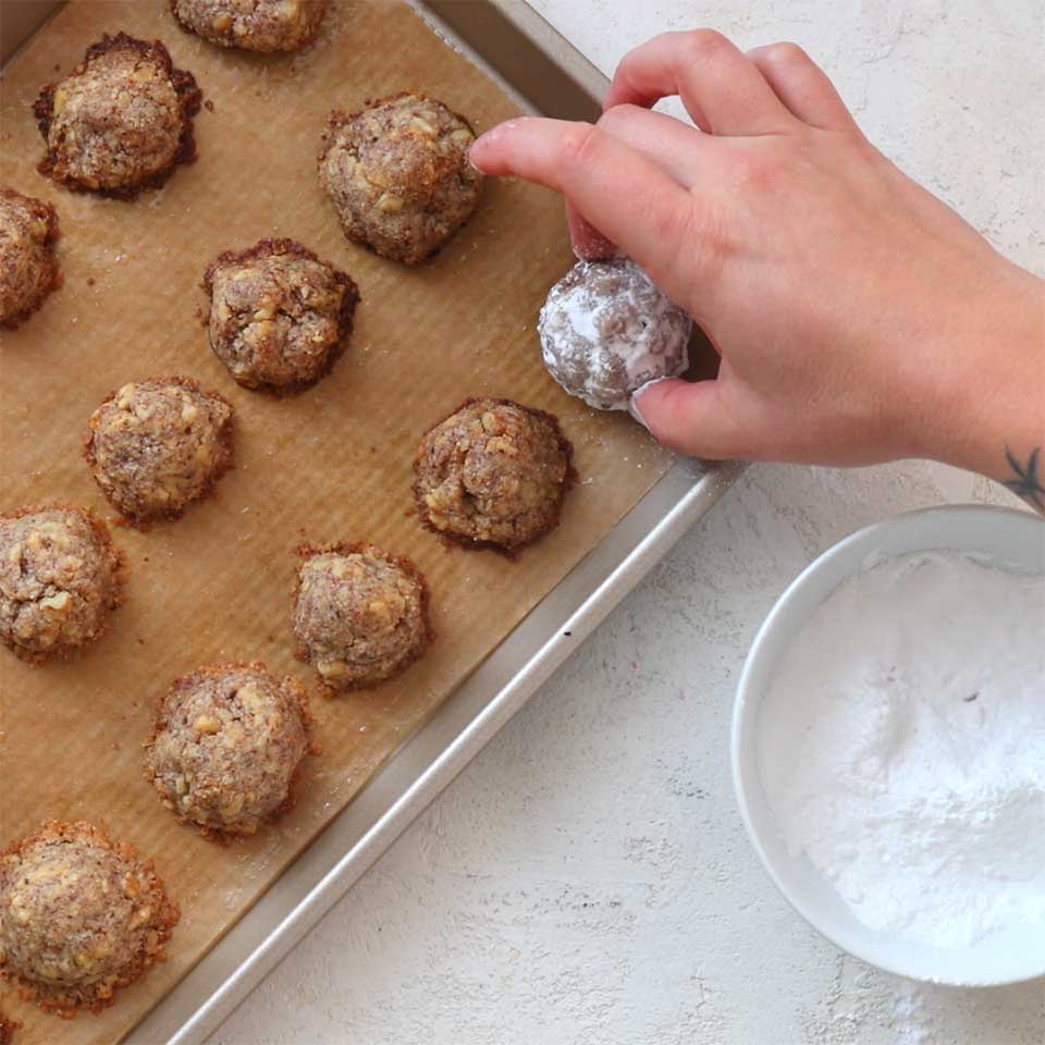 Keto snowball cookies on a baking sheet