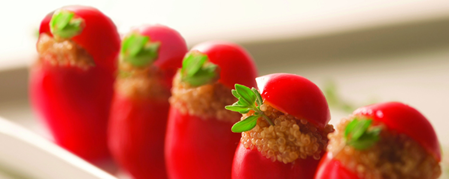 A closeup of several Organic Amaranth-Stuffed Cherry Tomatoes.