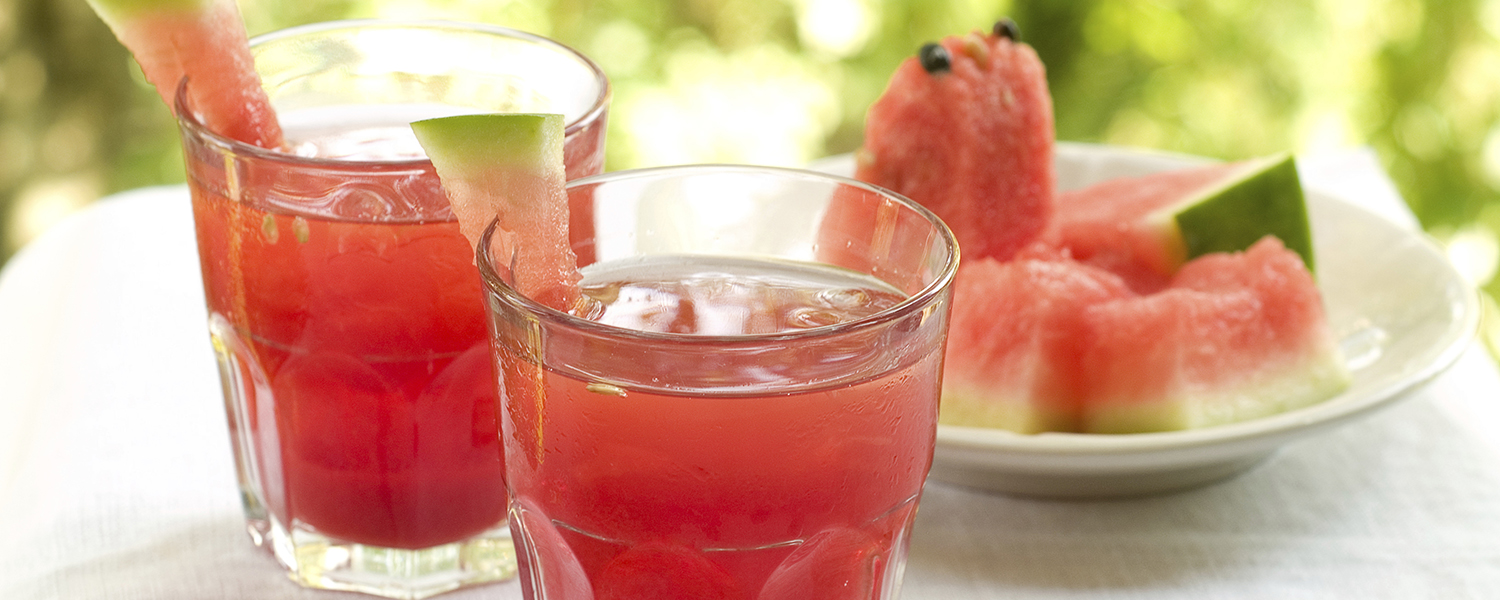 Two drink glasses are filled with Righteous Raspberry Watermelon Cooler.