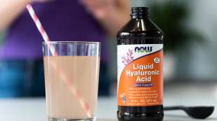 Liquid Hyaluronic Acid and glass with straw
