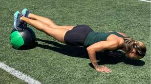 Chantae McMillan doing pushup on medicine ball