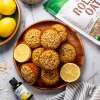 top view of Lemon Poppyseed Oat Muffins next to bottle of BetterStevia Lemon Twist and NOW Rolled Oats