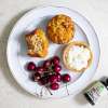 Morning Glory Muffins on a white plate with cherries