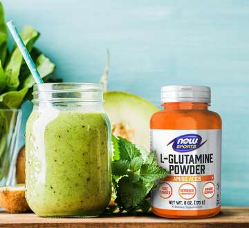 Green smoothie, parsley, and bottle of L-Glutamine Powder