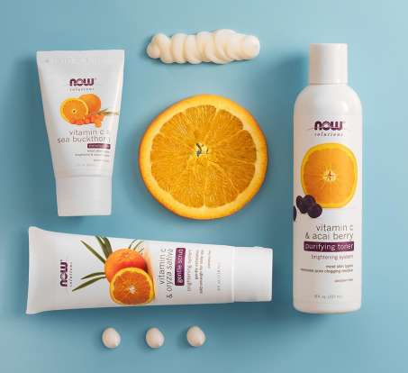 group of NOW Solutions products including Vitamin C Buckthorn moisturizer, Vitamin C & Oryza sativa gentle scrub, and Vitamin C & acai berry purifying toner