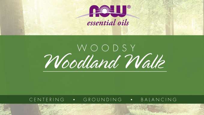 image of a wooded area as a background, purple now logo top center, green band across the middle, "WOODSY" in white text, "Woodland Walk" in white script