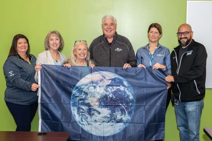 Earth Day 2022 - NOW Team holding flag