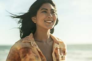 Women smiling on the beach. 