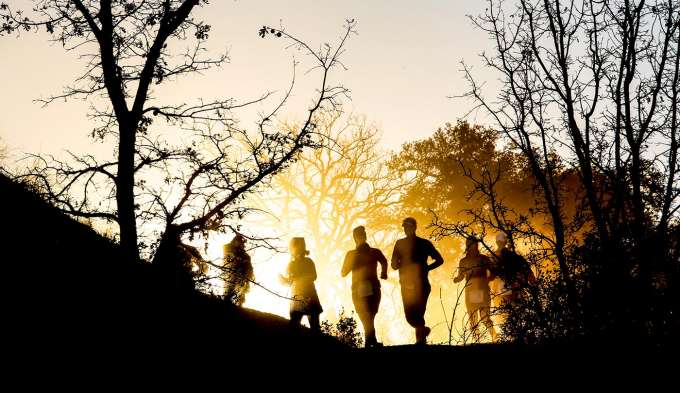 sunrise shadow figures running in nature