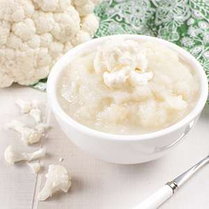 A small dipping dish holds a serving of Vegan Cauliflower Mash
