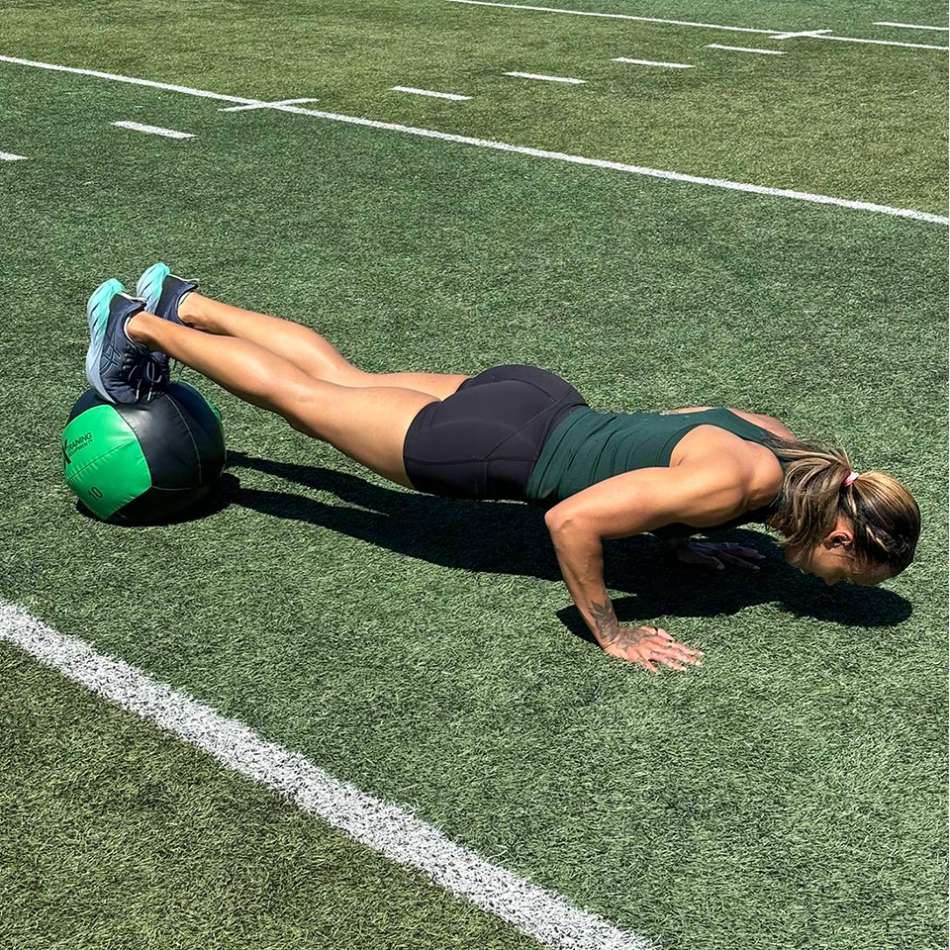 Chantae McMillan doing pushup on medicine ball