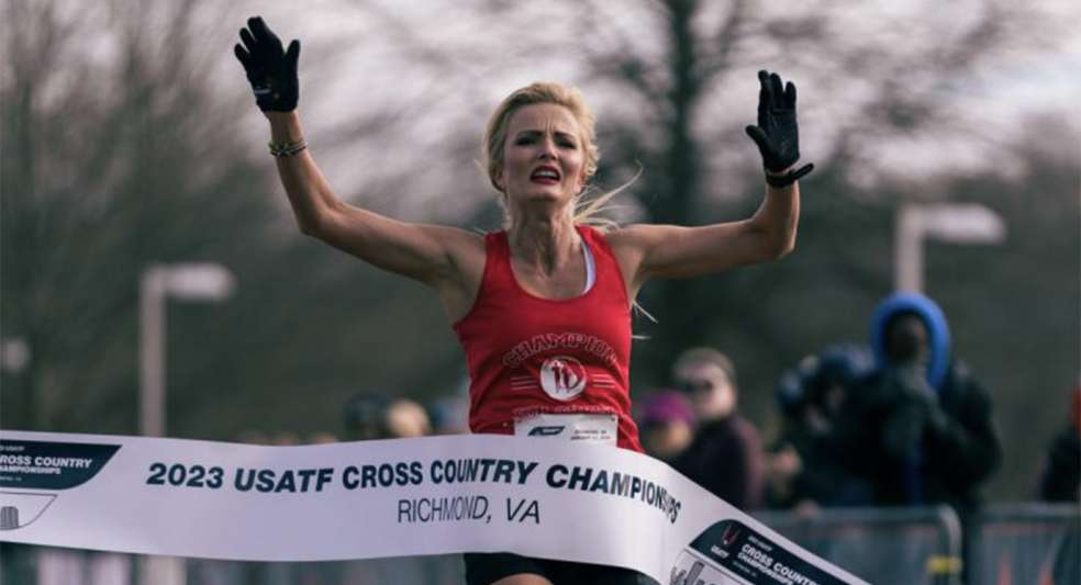April Lund crossing a finish line 
