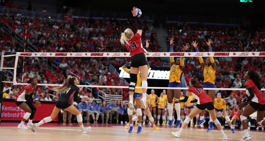 Anna DeBeer jumping to get a ball in Volleyball